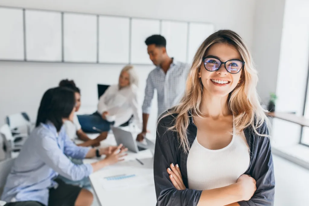 woman in boardroom smiling